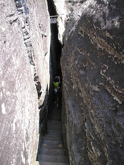 "Fat man squeeze", a narrow path between two boulders is featured in Rock City Gardens