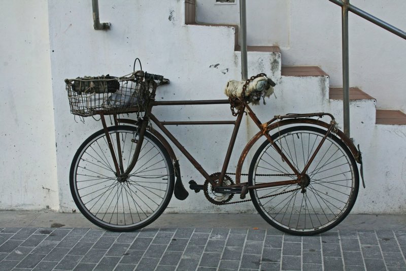 rusty bike near stairs - San Sebastian Spain