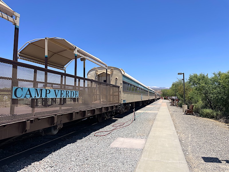 A specially designed open-air viewing platform constructed from an industrial railroad flatcar