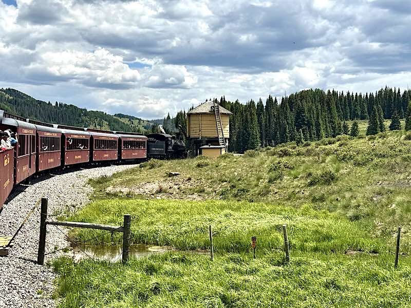 The Cumbres and Toltec Scenic Railroad taking on water at the Los Pinos Water Tank