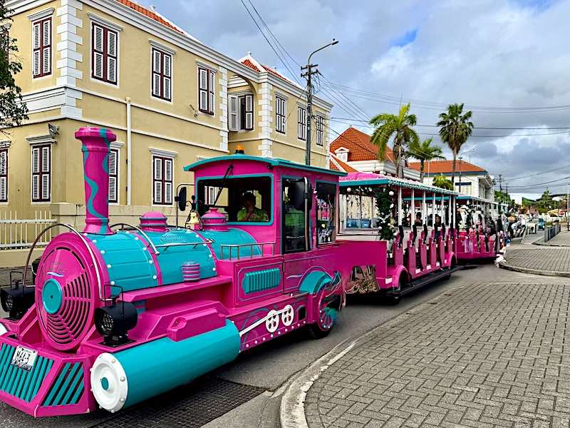 The pink tourist road train, which provides tours of downtown Willemstad